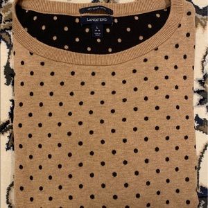 A brown and black polka dot sweater